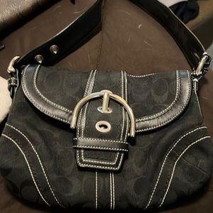 Small coach handbag gently used.  Black with silver buckles.